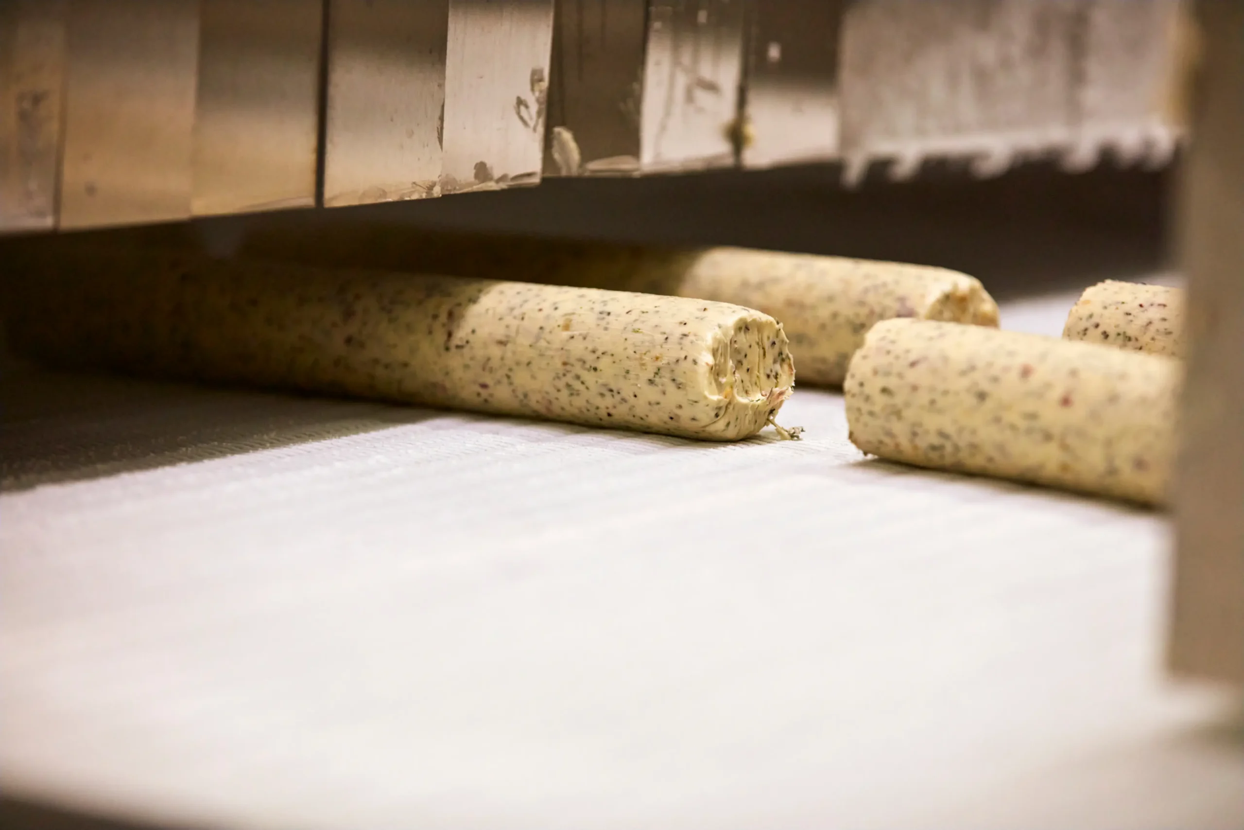Assorted compound butter chef rolls sliced for service
