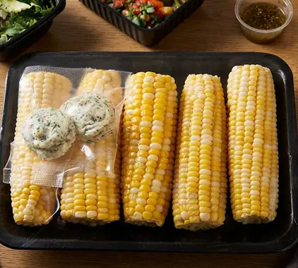 Wrapped butter medallions and flavored dollops packed as meal-kit ingredients