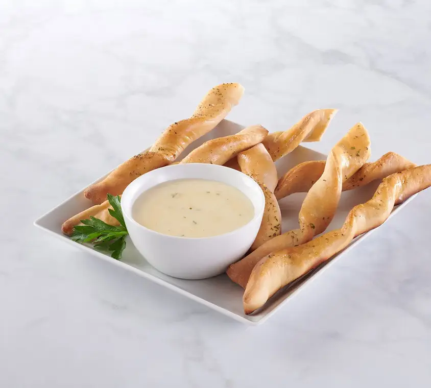 Flavored butter dollops pre-portioned for retail packaged foods
