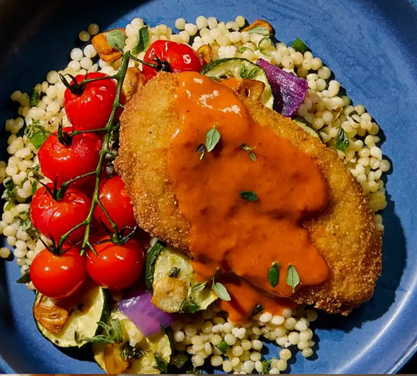A plated entree finished with a Butterball® Farms custom sauce