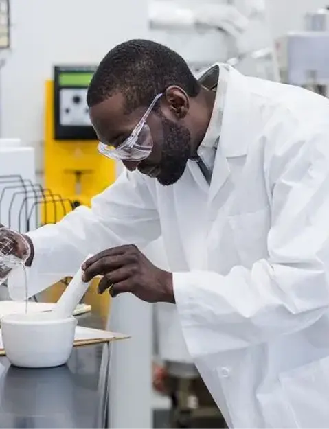 Butterball Farms food scientist in a lab coat developing and sampling new flavored butter recipes