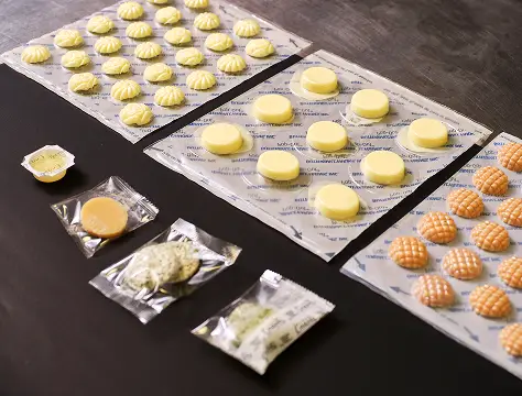 Chef tasting and evaluating a butter sauce sample