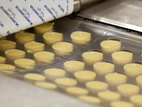 Production team scaling the approved recipe