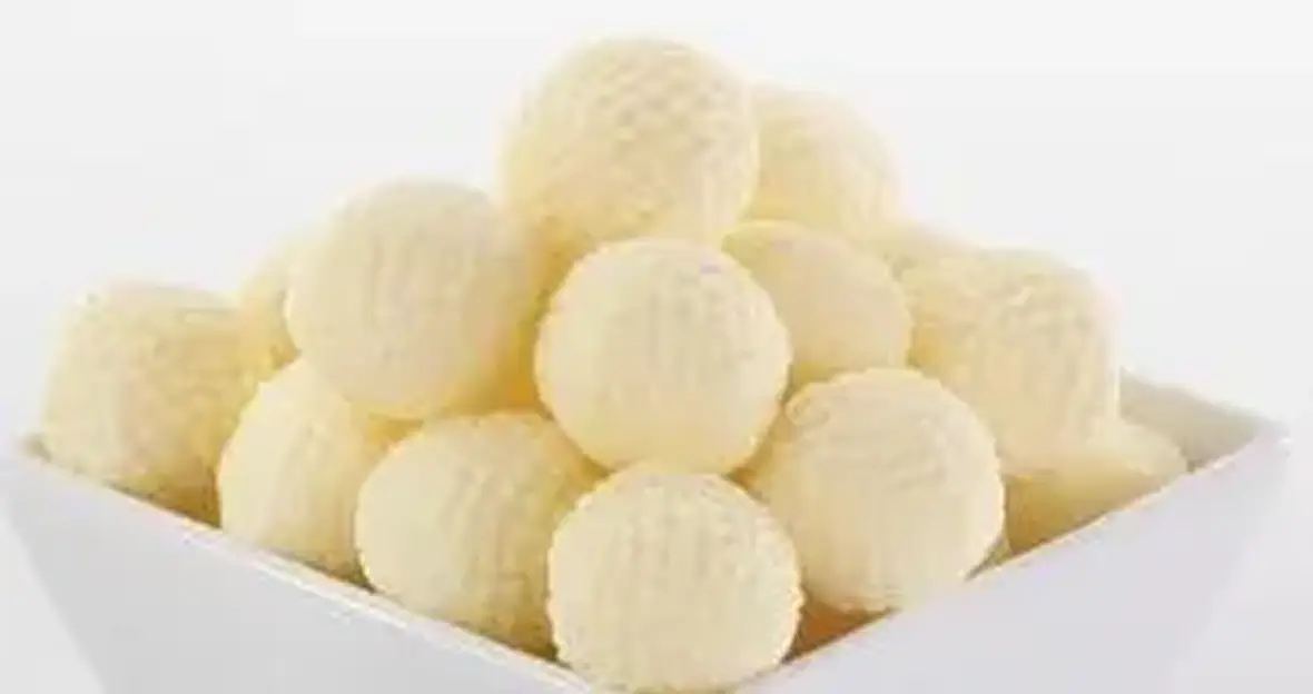 A plain wrapped butter pat labeled Boring beside an elegant Butterball rosette labeled Beautiful