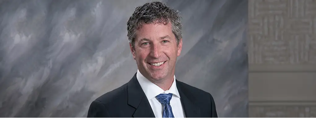Portrait of a smiling executive in a suit and tie