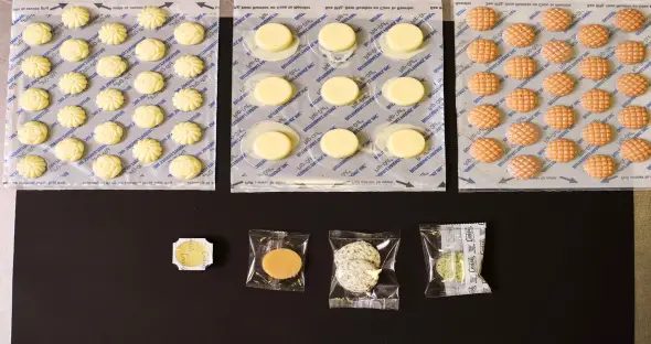 A plain wrapped butter pat labeled Boring beside an elegant Butterball rosette labeled Beautiful