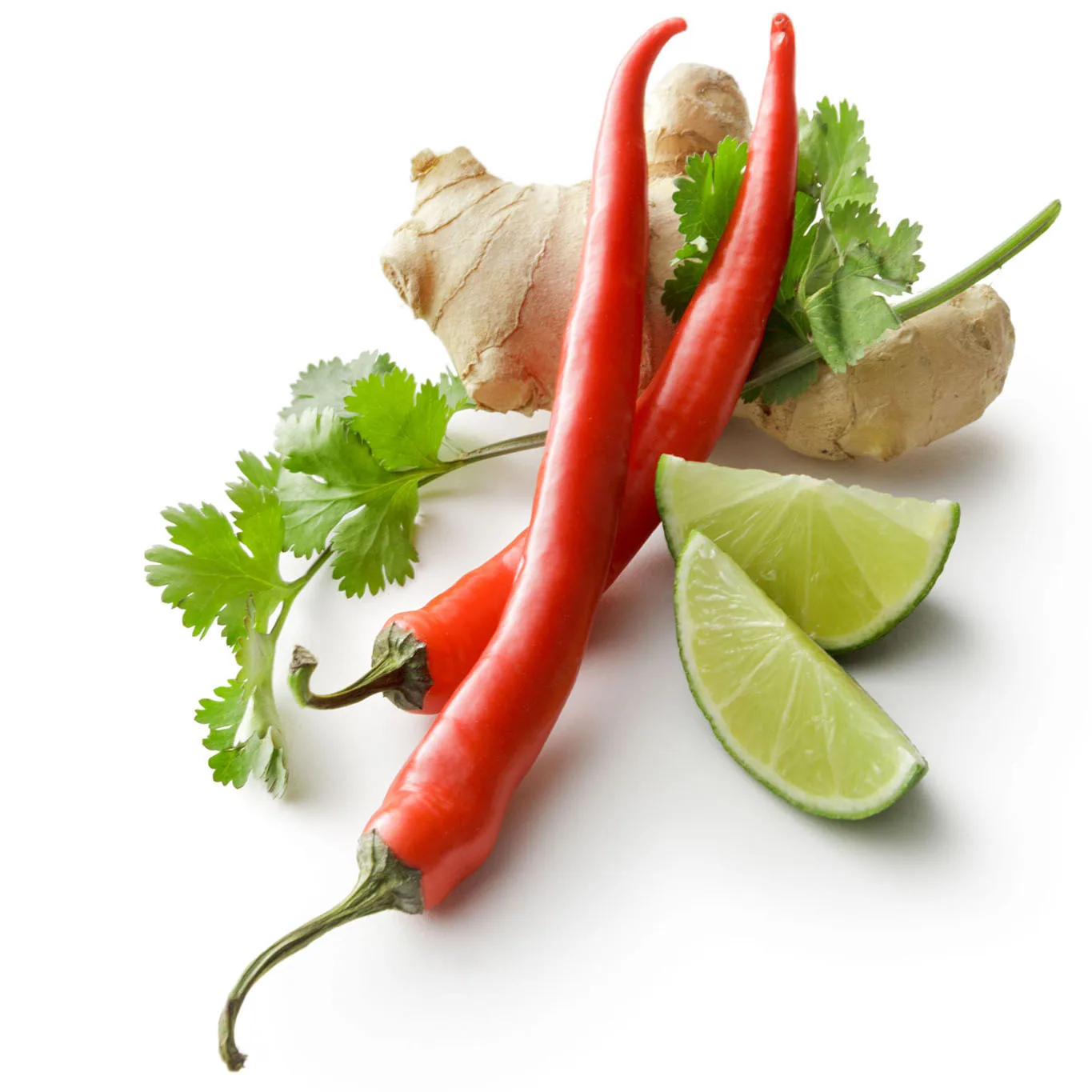 Red chilies, ginger root, cilantro and lime wedges