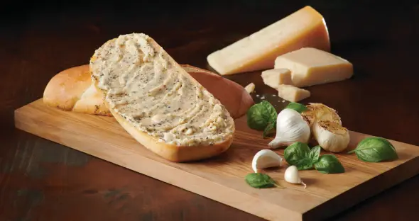 A plain wrapped butter pat labeled Boring beside an elegant Butterball rosette labeled Beautiful
